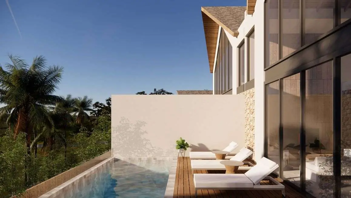 Pool terrace with sun loungers at a Samaya villa